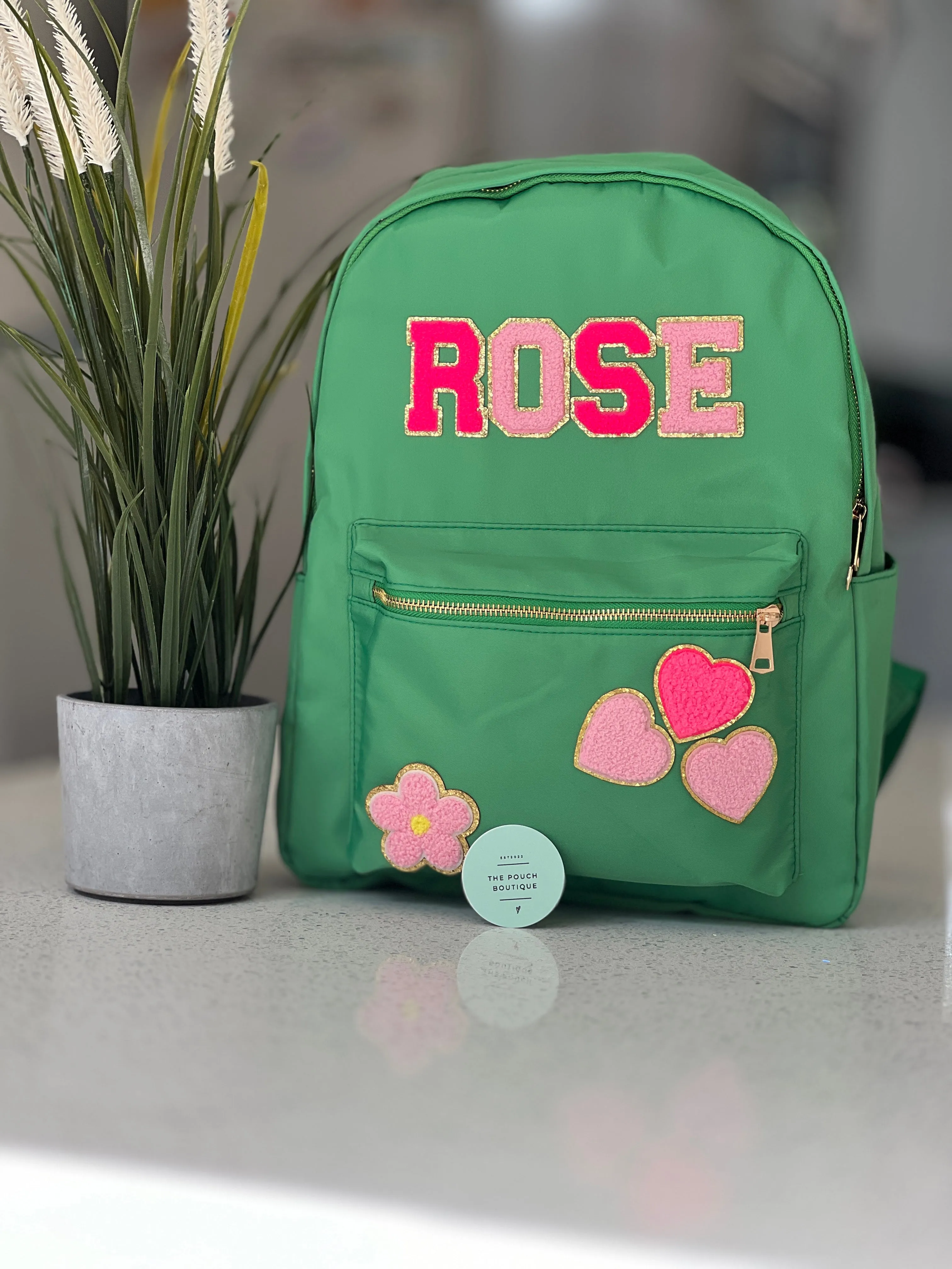 Best selling backpack with patch letter & motifs