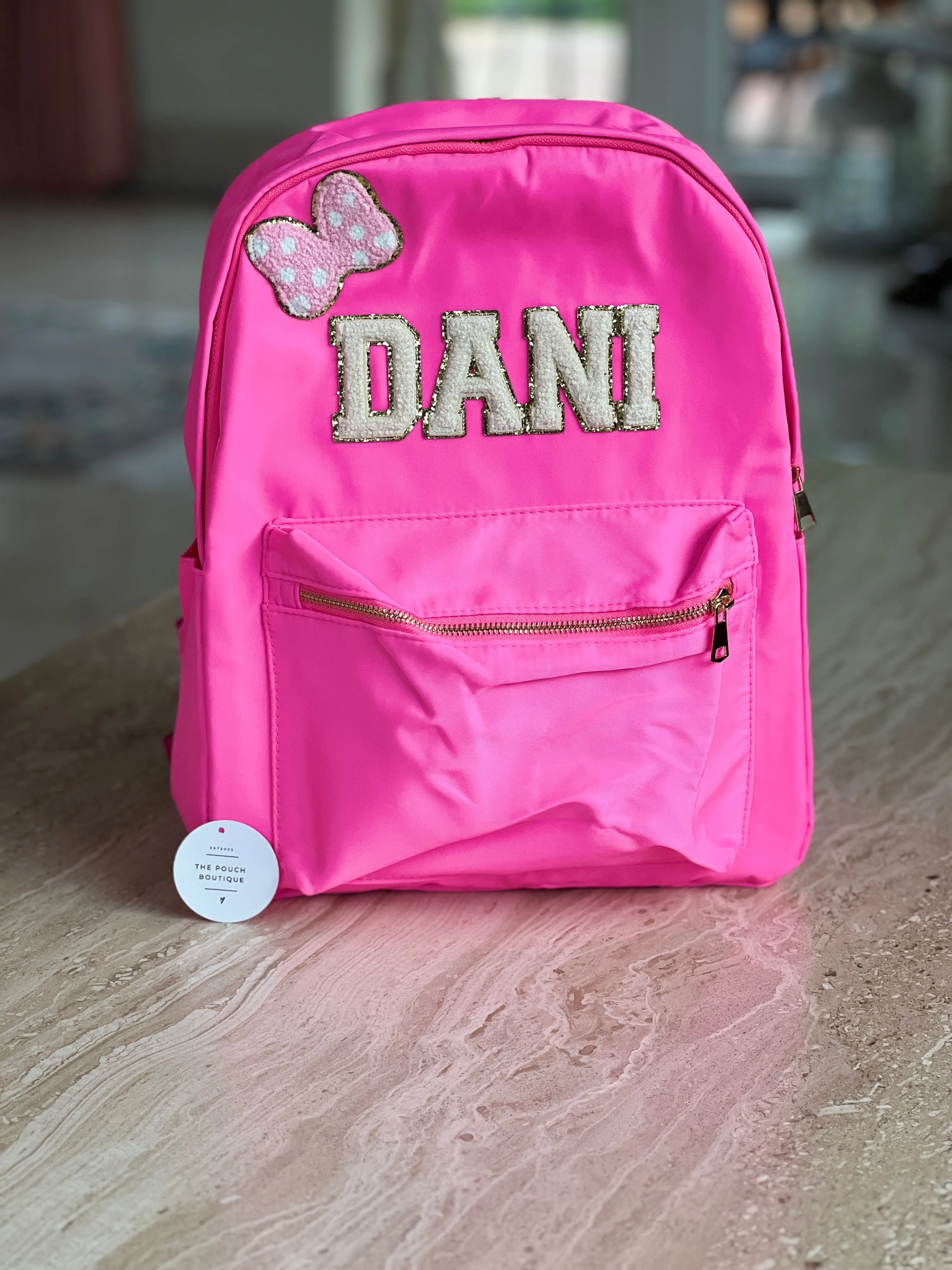 Best selling backpack with patch letter & motifs