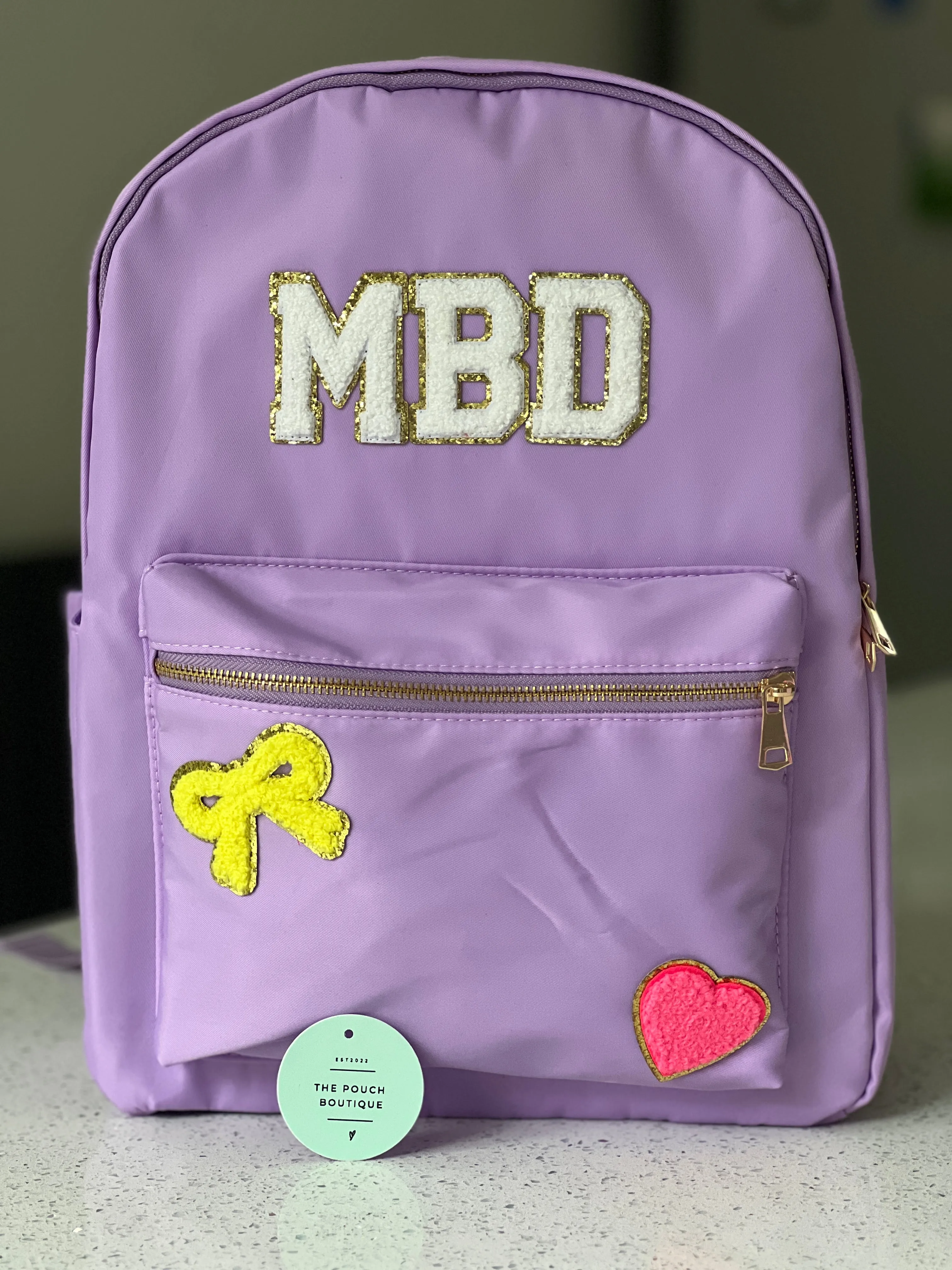 Best selling backpack with patch letter & motifs