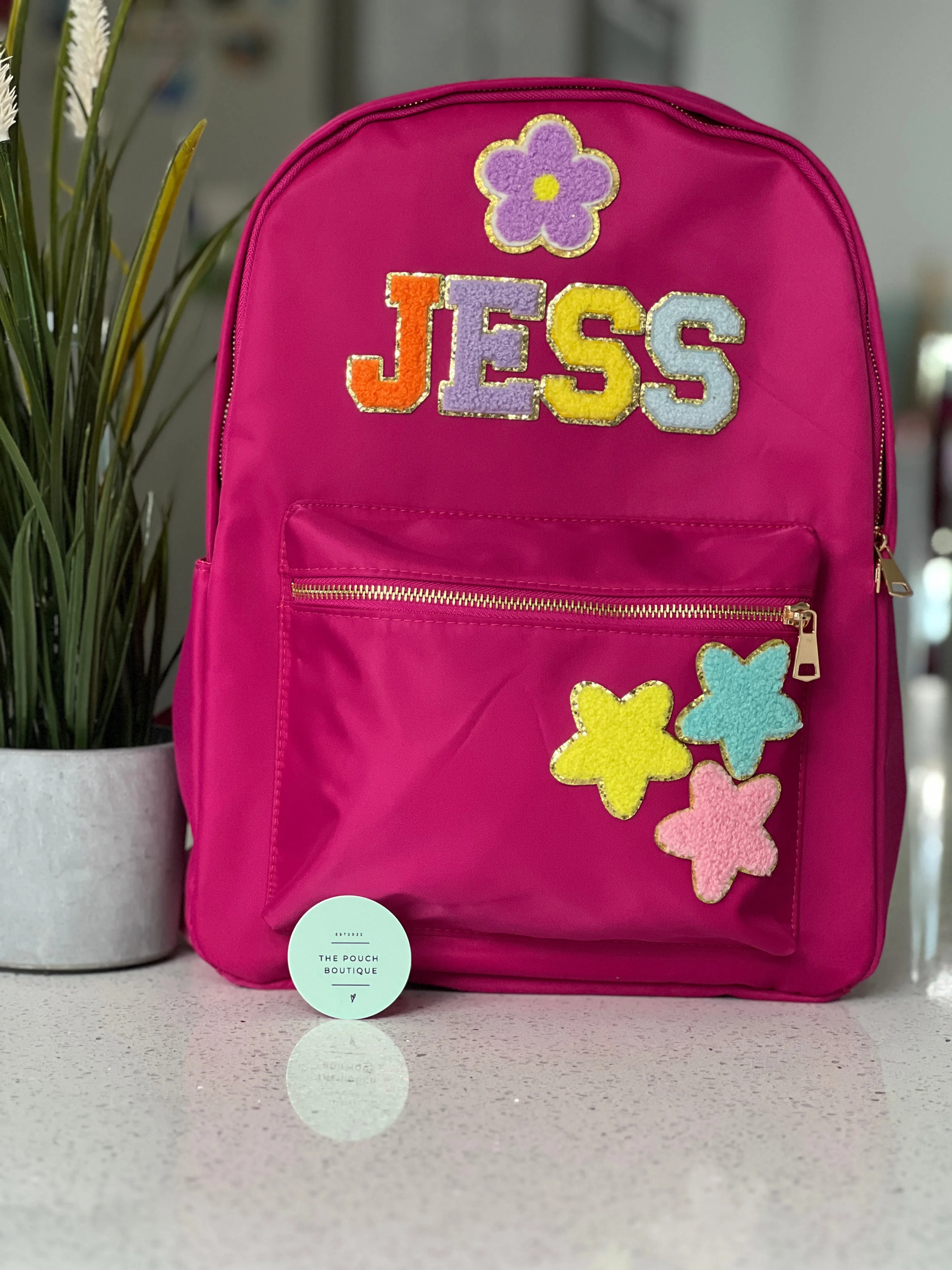 Best selling backpack with patch letter & motifs