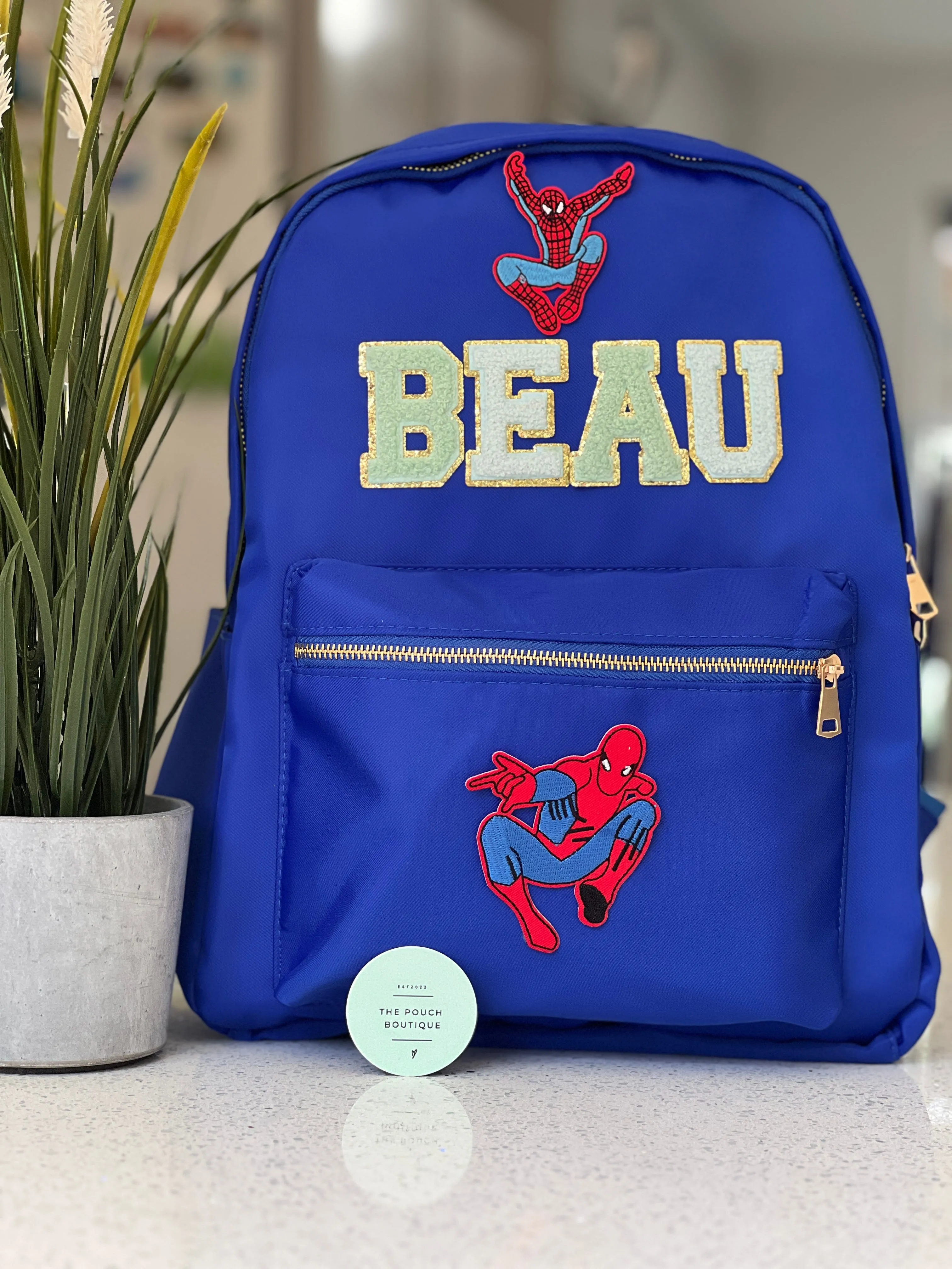 Best selling backpack with patch letter & motifs