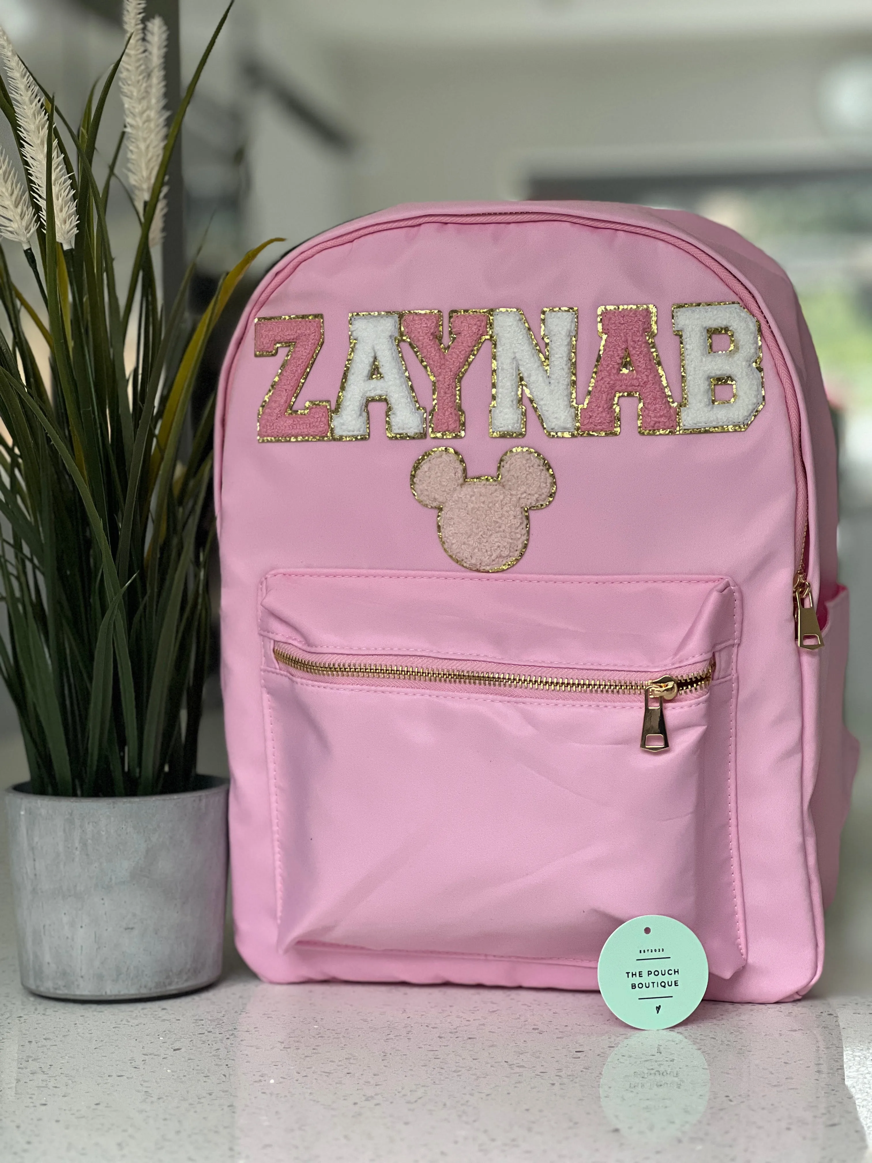 Best selling backpack with patch letter & motifs