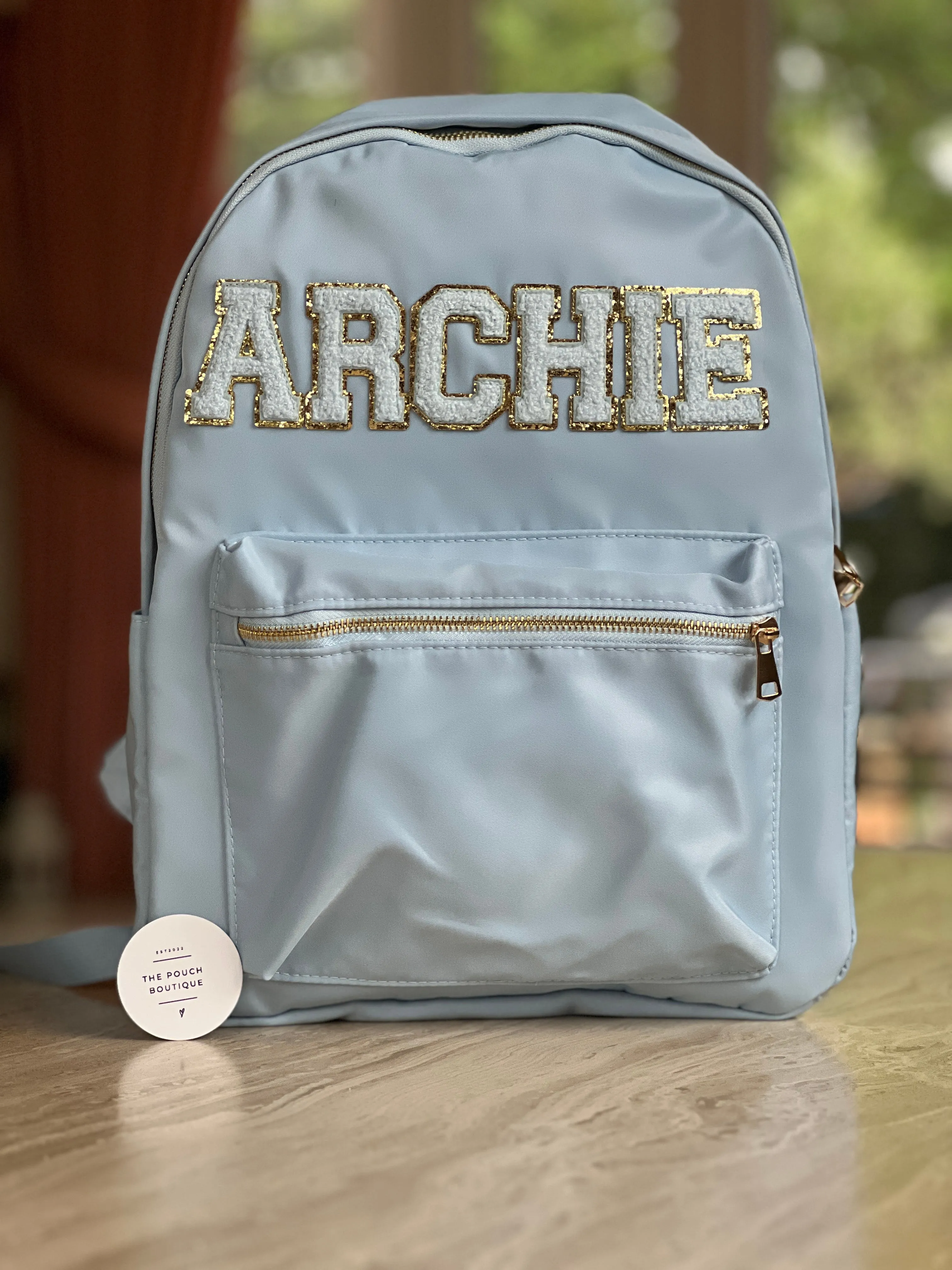 Best selling backpack with patch letter & motifs