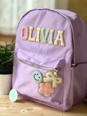 Best selling backpack with patch letter & motifs