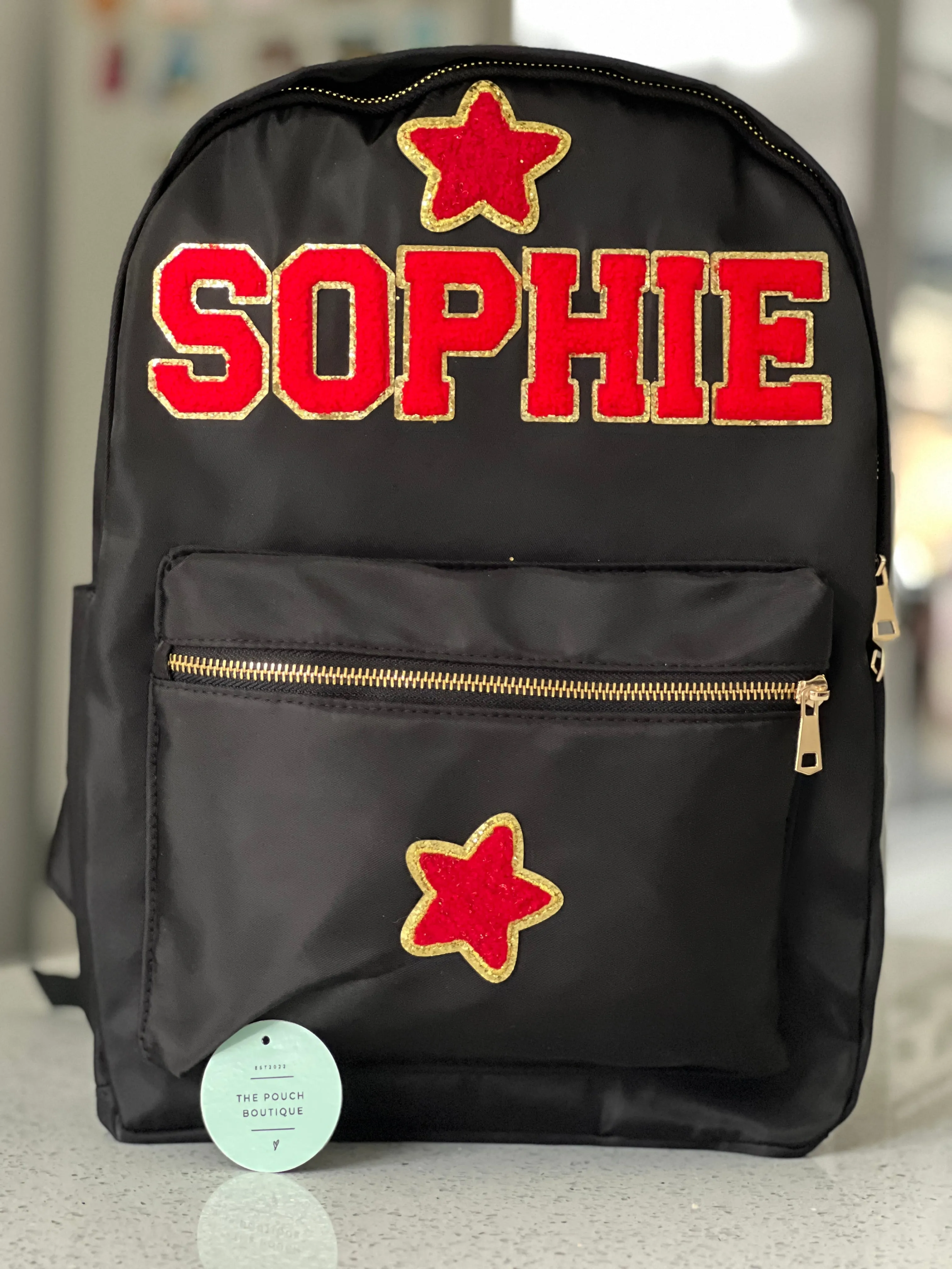 Best selling backpack with patch letter & motifs